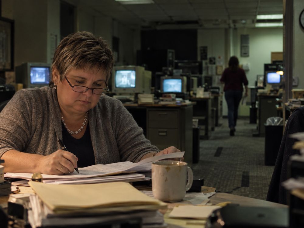 Illustrative portrait of Arles Hendershott Love marking up a script in a newsroom