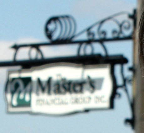 The Master's Financial Group hanging sign outside the Greeley office.
