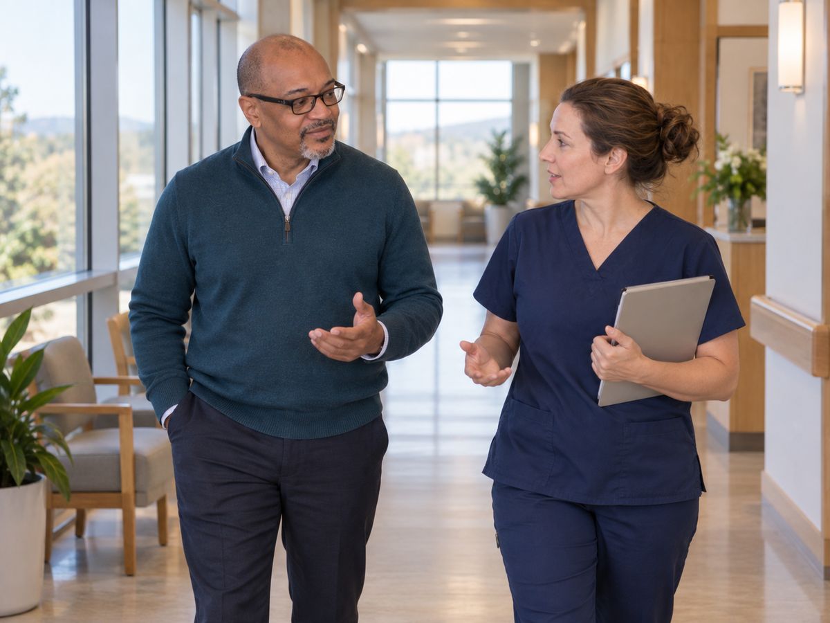 Walking a hospital corridor with a nurse