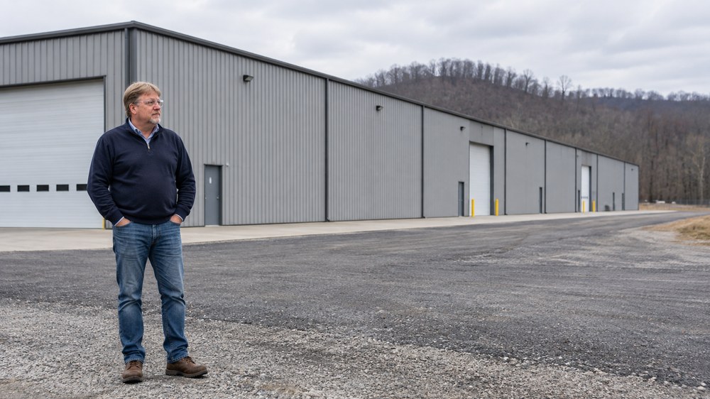 Shane Wallingford standing in the yard in front of the newly completed manufacturing building