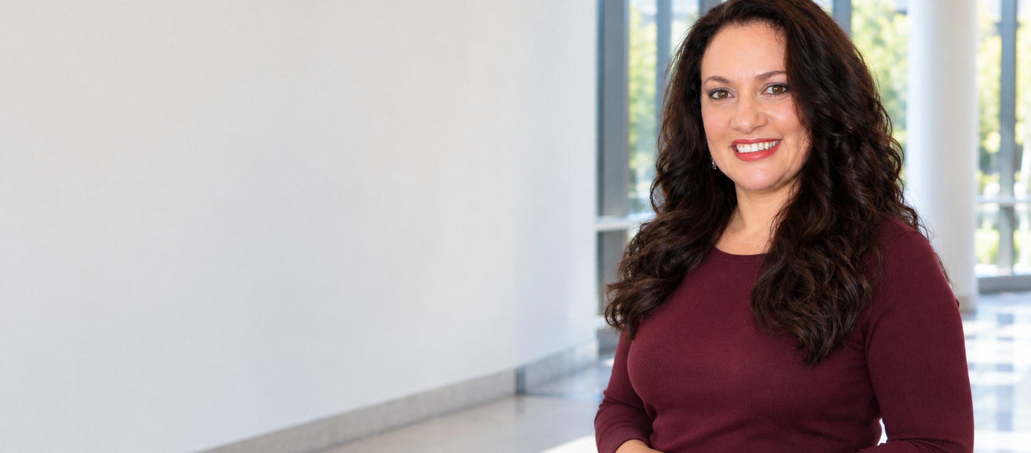 Dr. Katz-Levin standing in a university teaching atrium